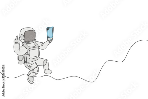 One single line drawing of space man astronaut exploring cosmic galaxy, pose selfie with mobile phone vector illustration. Fantasy outer space life fiction concept. Modern continuous line draw design