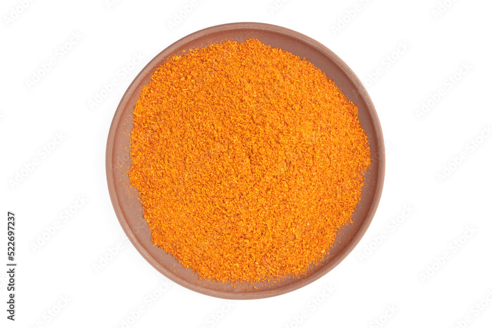 Red chili pepper in clay plate isolated on white. Macro. Flat lay. Diet and weight loss concept Red chili pepper in clay plate isolated on white. Macro. Flat lay. Diet and weight loss concept