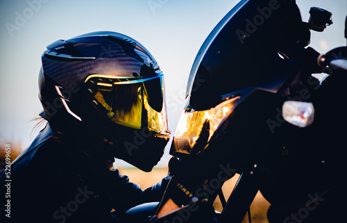 Biker woman looking face to face at motorcycle headlight in jerez de la frontera spain photo