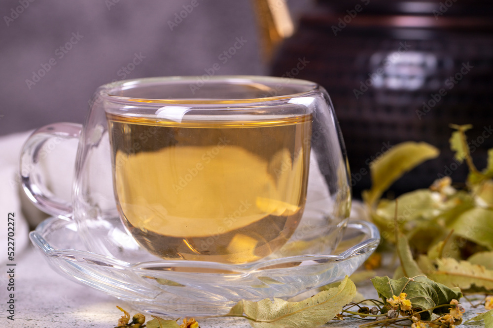 Linden tea. Linden tea on stone background. Herbal tea concept. Healthy drinks. close up Linden tea. Linden tea on stone background. Herbal tea concept. Healthy drinks. close up