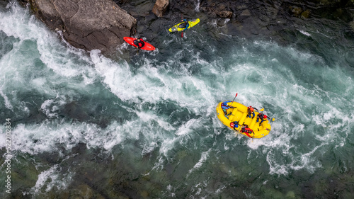 Quadro su tela Group of friends spending time on the river enjoying kayaking and rafting togeth