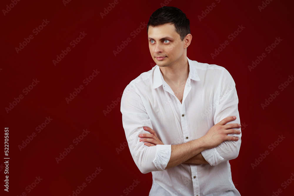 smiling young guy posing with crossed arms smiling young guy posing with crossed arms