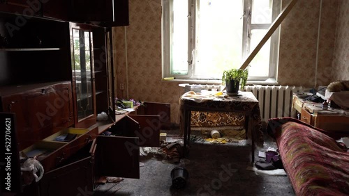 The apartment of the inhabitants after the evacuation during the bombing of a peaceful city. Left belongings of residents. Bombed apartments. Fire in the house. Traces of hits from. Irpin. Ukraine.