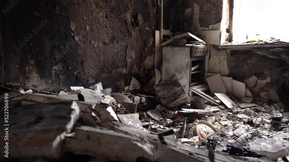 The apartment of the inhabitants after the evacuation during the bombing of a peaceful city. Left belongings of residents. Bombed apartments. Fire in the house. Traces of hits from. Irpin. Ukraine. The apartment of the inhabitants after the evacuation during the bombing of a peaceful city. Left belongings of residents. Bombed apartments. Fire in the house. Traces of hits from. Irpin. Ukraine.