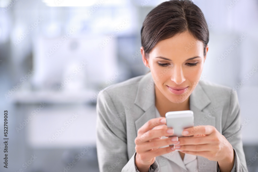 Businesswoman browsing social media on a phone at work in a modern office. Female chatting online, signing up to a dating app or social website. Lady reading updates on the internet while on a break Businesswoman browsing social media on a phone at work in a modern office. Female chatting online, signing up to a dating app or social website. Lady reading updates on the internet while on a break