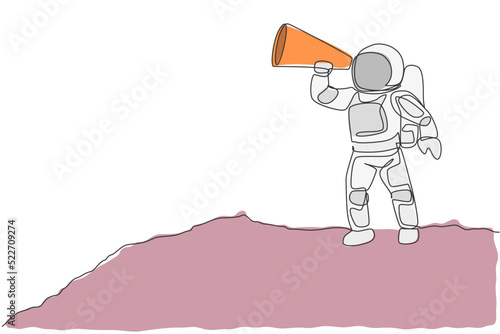 One single line drawing of young astronaut holding paper speaker to announce loudly some rules in moon surface vector illustration. Cosmonaut deep space concept. Modern continuous line draw design