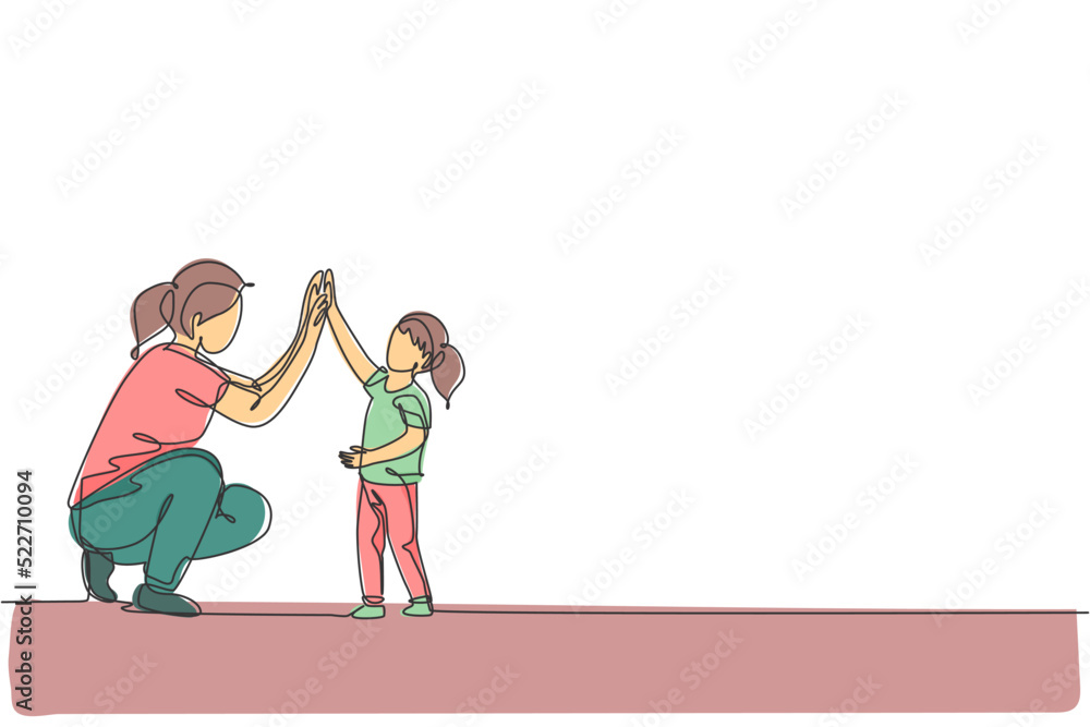 One continuous line drawing of young happy mom giving high five to daughter, celebrate her success for school achievement. Family parenting concept. Dynamic single line draw design vector illustration
