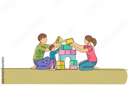 One continuous line drawing of young happy mother and father playing with son building house from foam puzzle blocks toy at home. Family parenting concept. Single line draw design vector illustration