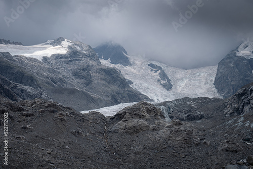 Melting glaciers and bare rocks in the Swiss Alps. Mountain meltdown because of climate change.