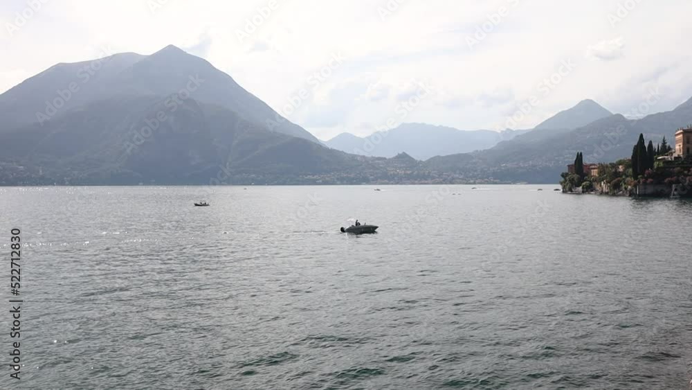 Water Landscape of Varenna at Lake Como in Italy. Scenic View of Lario with Mountains in Lombardy. Water Landscape of Varenna at Lake Como in Italy. Scenic View of Lario with Mountains in Lombardy.