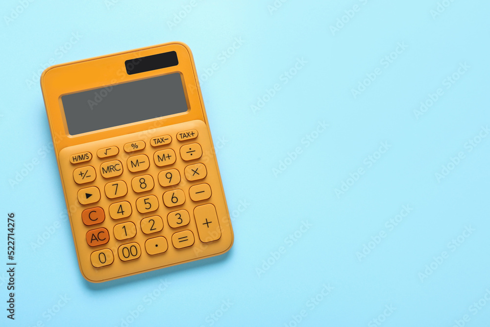Orange calculator on turquoise background, top view. Space for text Orange calculator on turquoise background, top view. Space for text