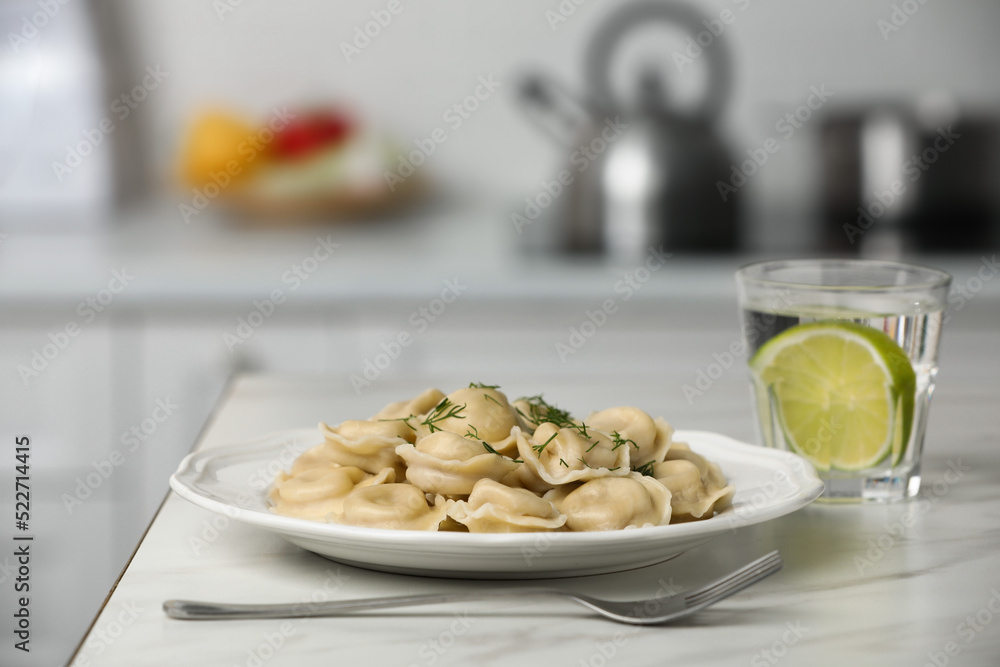 Delicious dumplings on white table in kitchen Delicious dumplings on white table in kitchen