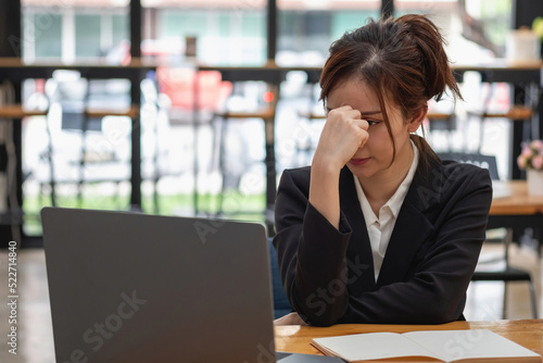 Burnout syndrome at work concept. exhausted overworked woman working in office.Concept Burnout Syndrome.