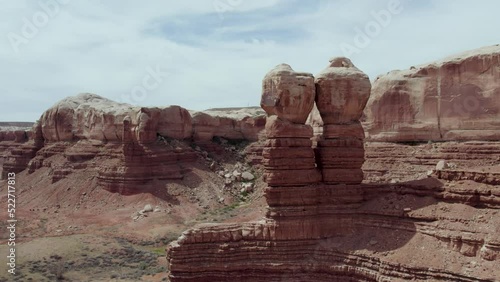 Aerial Drone Flight by Sandstone Cliff Rock Formations in Utah and Arizona's National Park Southwest Desert photo