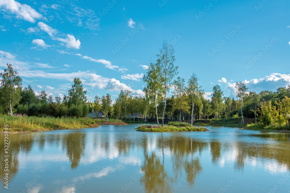 Naklejka premium Rural landscape with lake and village houses.