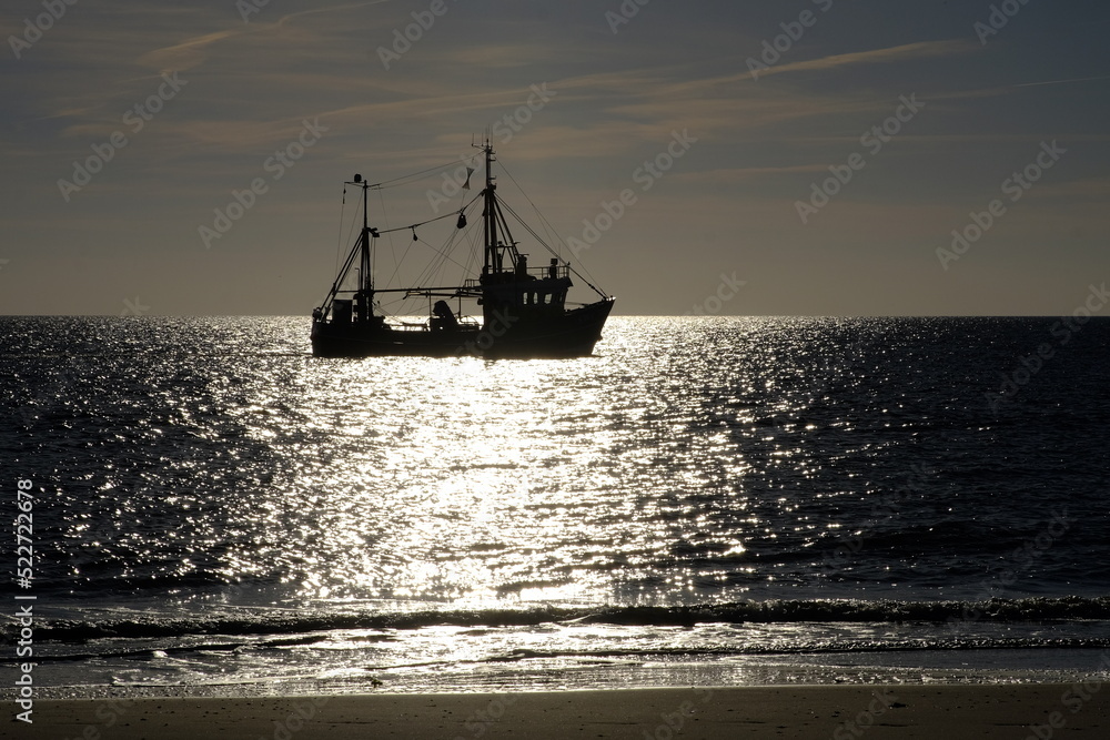 fishing boat in sunset