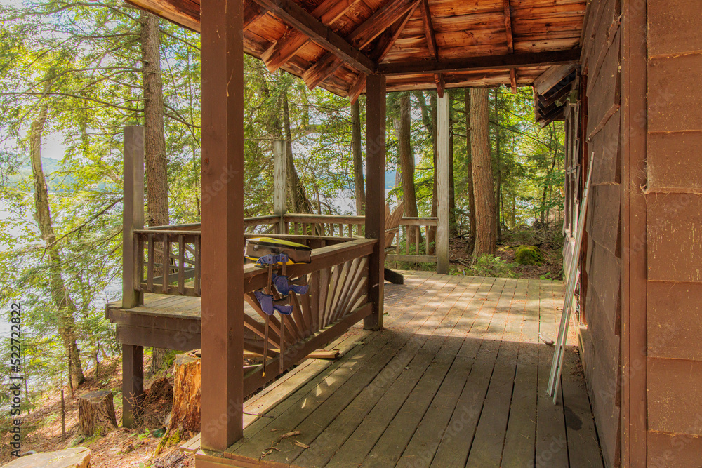 wooden cabin porch in woods
