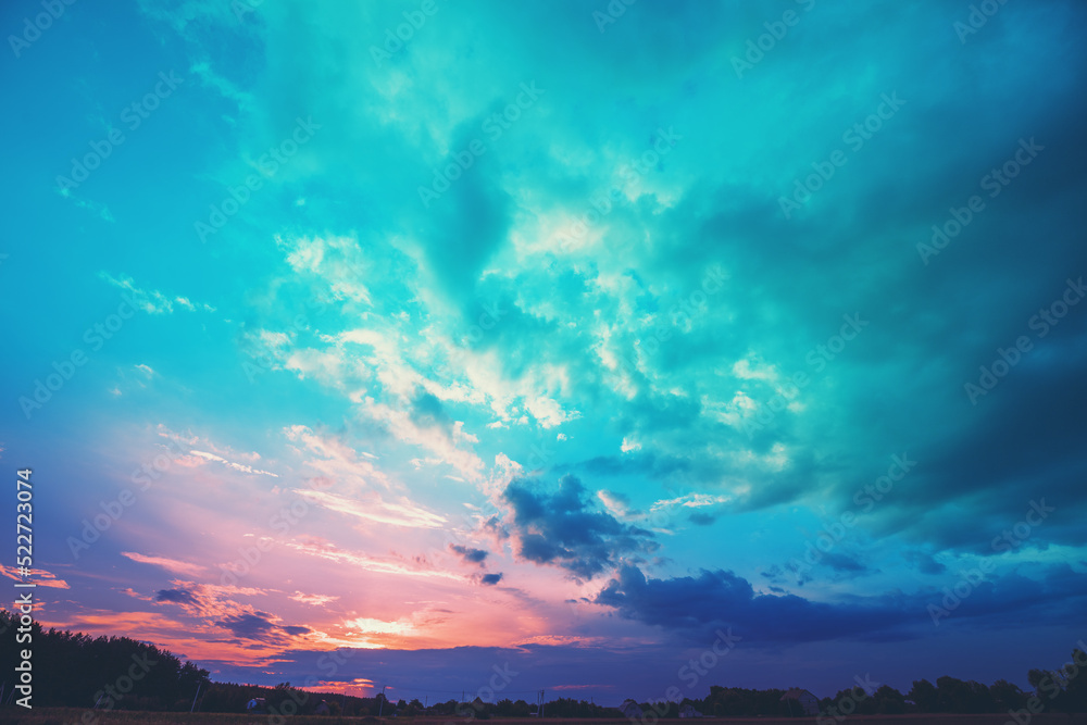 Colorful cloudy sky at sunset. Sunset in the countryside