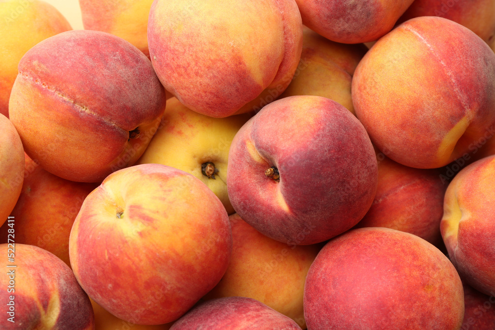 Fresh ripe peaches as background, closeup view Fresh ripe peaches as background, closeup view
