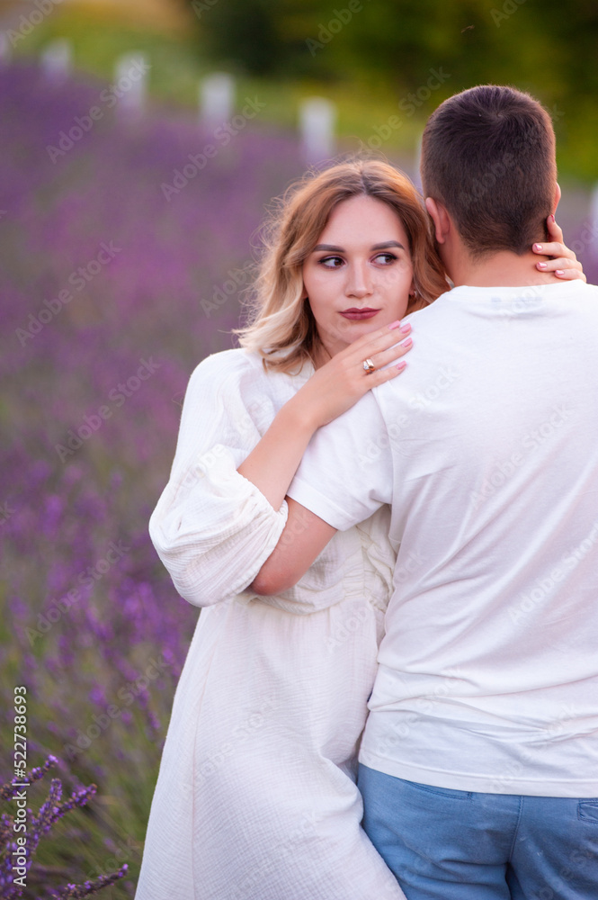 Young couple in love bride and groom, wedding day in summer. Enjoy a moment of happiness and love in a lavender field. Young couple in love bride and groom, wedding day in summer. Enjoy a moment of happiness and love in a lavender field.
