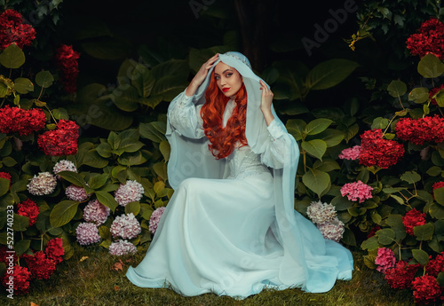 Photography Fantasy woman in white vintage dress head covered with veil