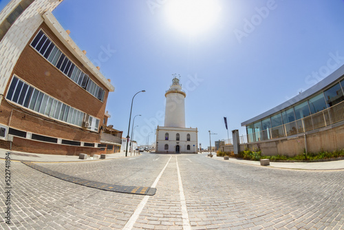 Malaga lighthouse with open street and sunny day with copy space