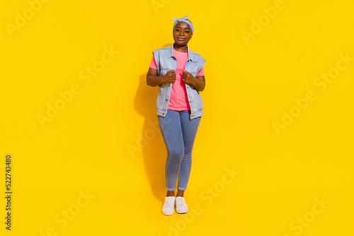 Full size photo of lady standing isolated on vibrant shine color background touch her new boutique clothes