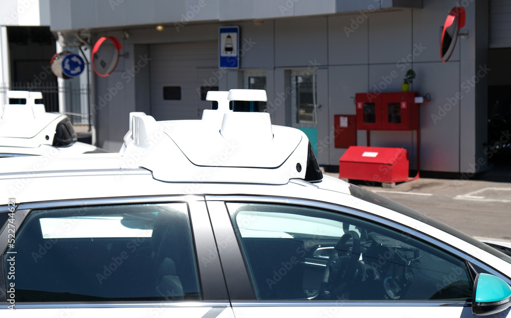 LiDAR sensors and Camera on roof of self-driving car. Self-driving car system undergoing testing. The vehicle is equipped with numerous LiDAR sensors.High definition LiDAR for self driving car sensor. LiDAR sensors and Camera on roof of self-driving car. Self-driving car system undergoing testing. The vehicle is equipped with numerous LiDAR sensors.High definition LiDAR for self driving car sensor.