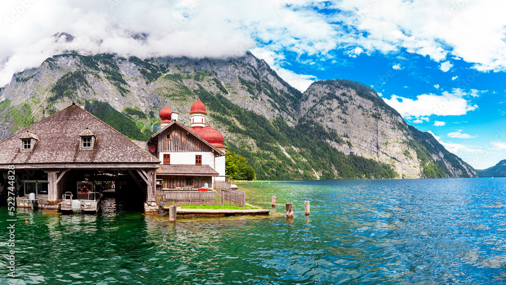 Fototapeta premium Mountain Watzmann and Pilgrimage church Sankt Bartholomä at Lake Koenigssee near Berchtesgaden Alps, Bavaria, Germany. East mountain range of the Watzmann massif in summer