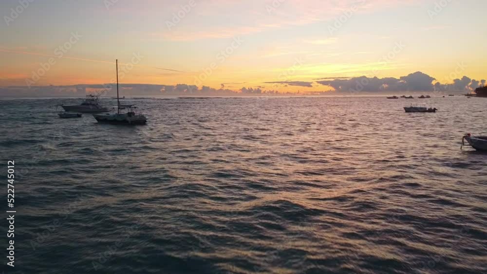 Aerial drone shot of the ocean in the Dominican republic passing boats Aerial drone shot of the ocean in the Dominican republic passing boats