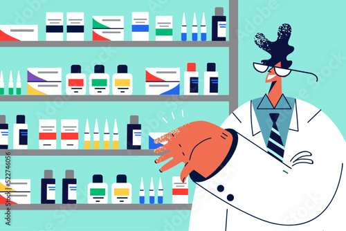 Smiling male pharmacist working in drugstore 