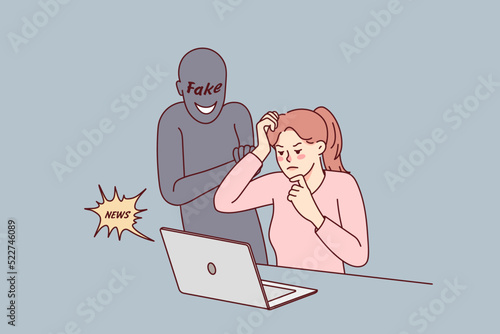Confused woman looking at computer screen reading fake news online. Frustrated female use laptop worried about notification on web. Propaganda and media manipulation. 