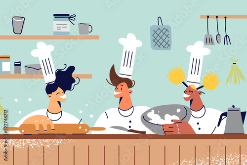 Happy kids have fun cooking on kitchen 