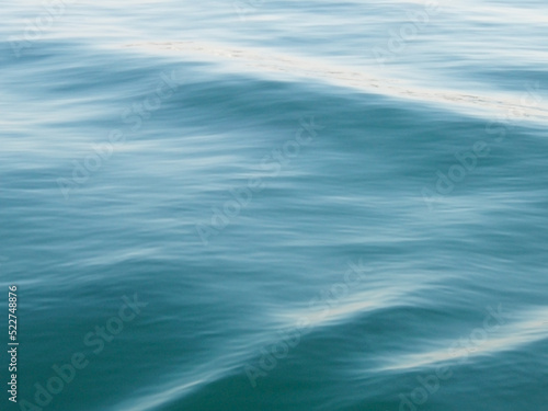 Calm sea surface waving texture.