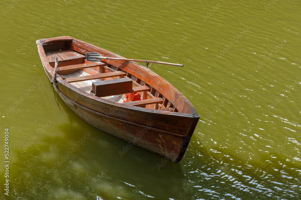 Large wooden pleasure boat in the city park Sofiyivka Uman city Large wooden pleasure boat in the city park Sofiyivka Uman city