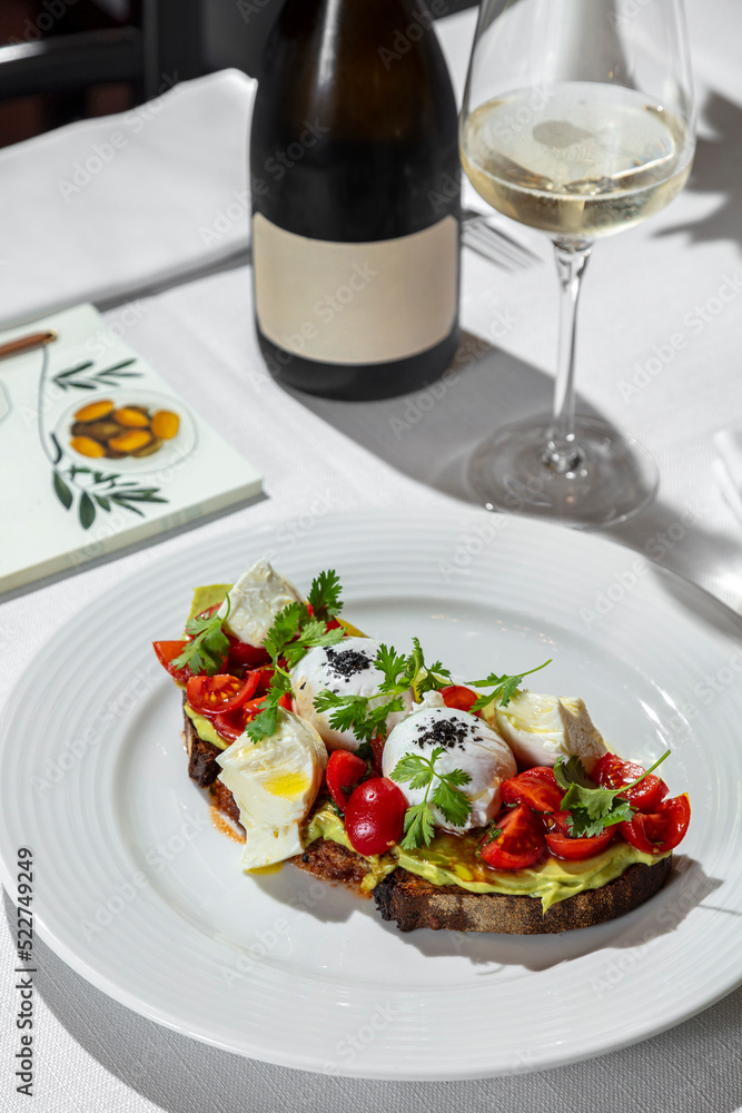 Bruschetta with tomatoes and poached egg Bruschetta with tomatoes and poached egg