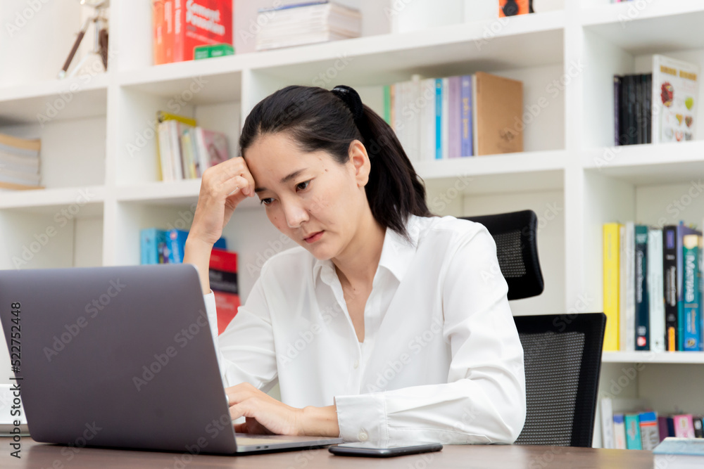 sad depression serious people from work,study stress problem.asian woman feeling tired suffering using computer working work place.concept global economic,health problems