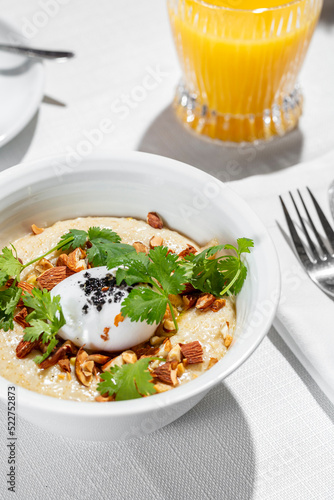 Oatmeal with nuts and poached egg