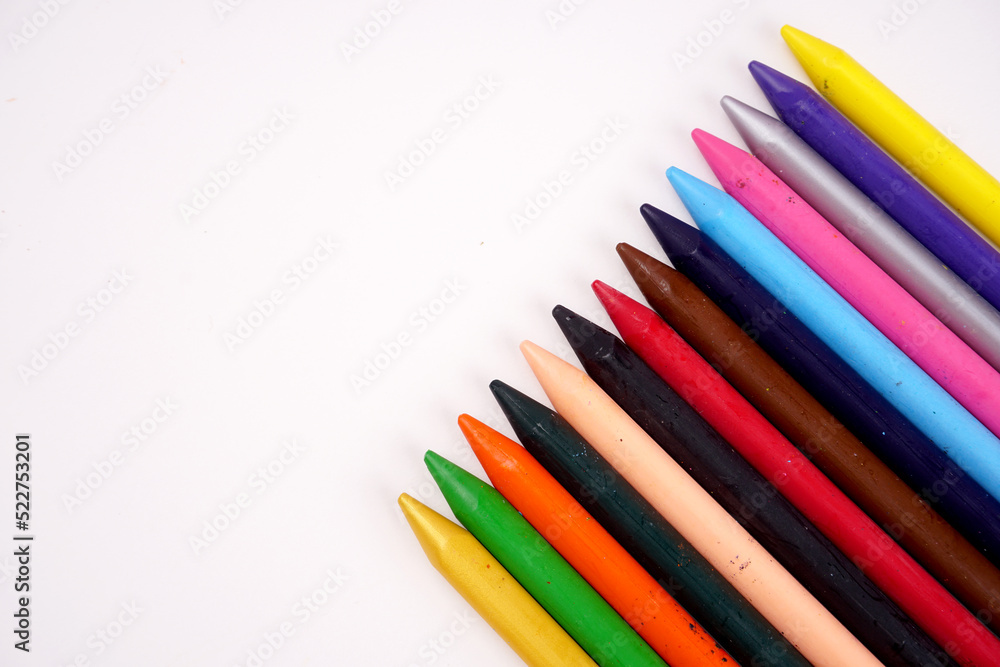 Color pencils on pink background, copy space . Color pencils on pink background, copy space .
