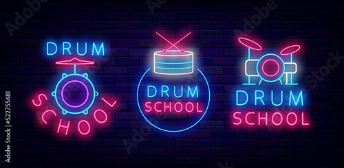 Drum school neon signs collection. Music education labels set on brick wall. Drum kit icon. Vector stock illustration