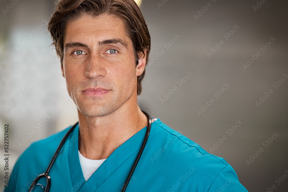 Determined young doctor looking at camera Determined young doctor looking at camera