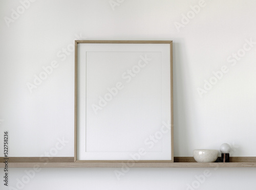 Wooden frame mockup close up on a wooden shelf with decor, 3d render