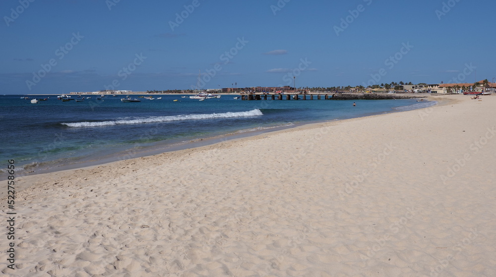 Empty beach with pier on Atlantic Ocean at Sal island, Cape Verde