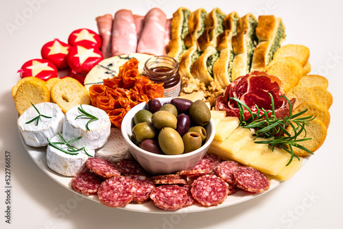 Photography Lunch meal or appetiser including a single dish with salami, pepperoni, brie cheese, ham