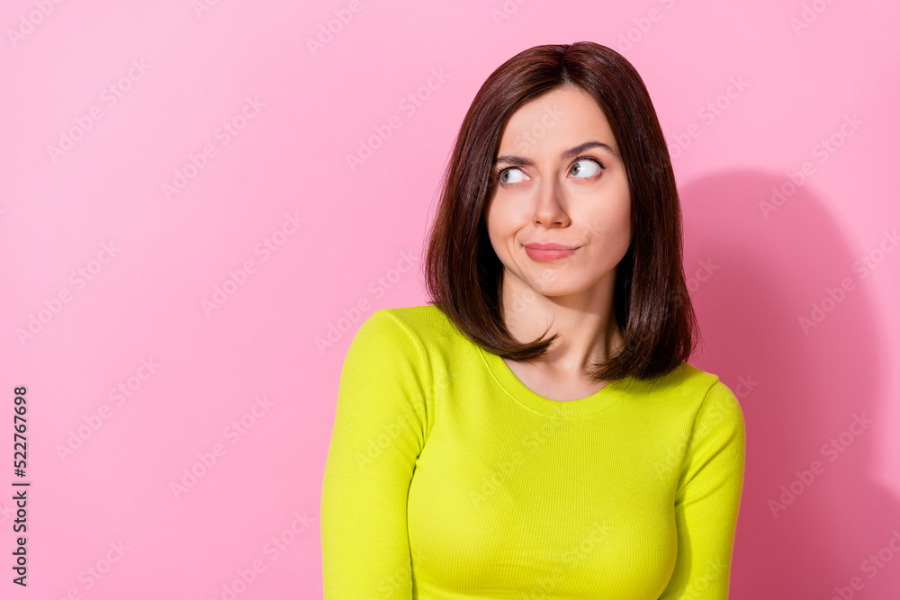 Portrait of minded doubtful person look interested empty space ponder isolated on pink color background Portrait of minded doubtful person look interested empty space ponder isolated on pink color background