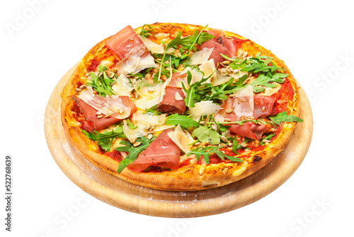 Pizza with dry cured ham, parmesan cheese, rocket leaves and pine nuts on wooden platter isolated with transparent background