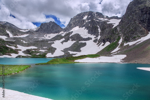 A beautiful alpine lake surrounded by mountains. Soft focus.
