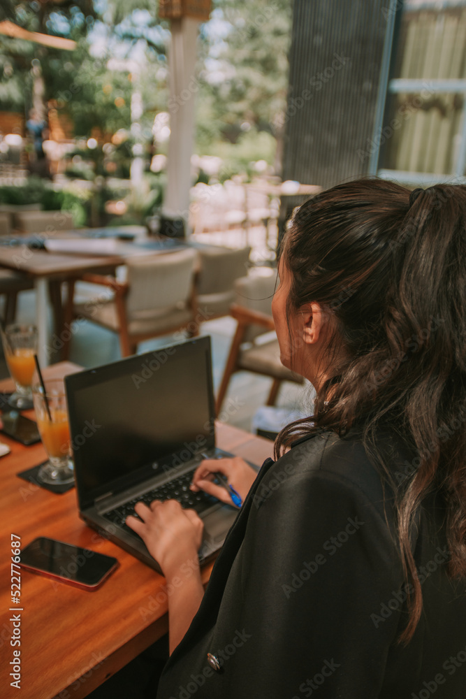 Business woman typing on the computer Business woman typing on the computer