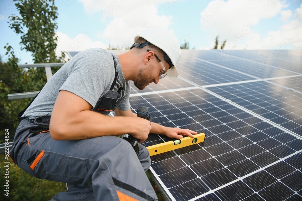 A man working at solar power station. A man working at solar power station.