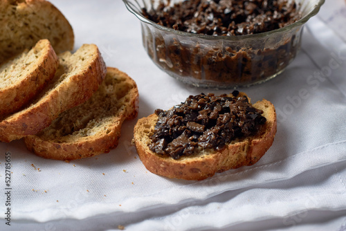 Tapenade, paste made from olives. Bowl with spreadable black